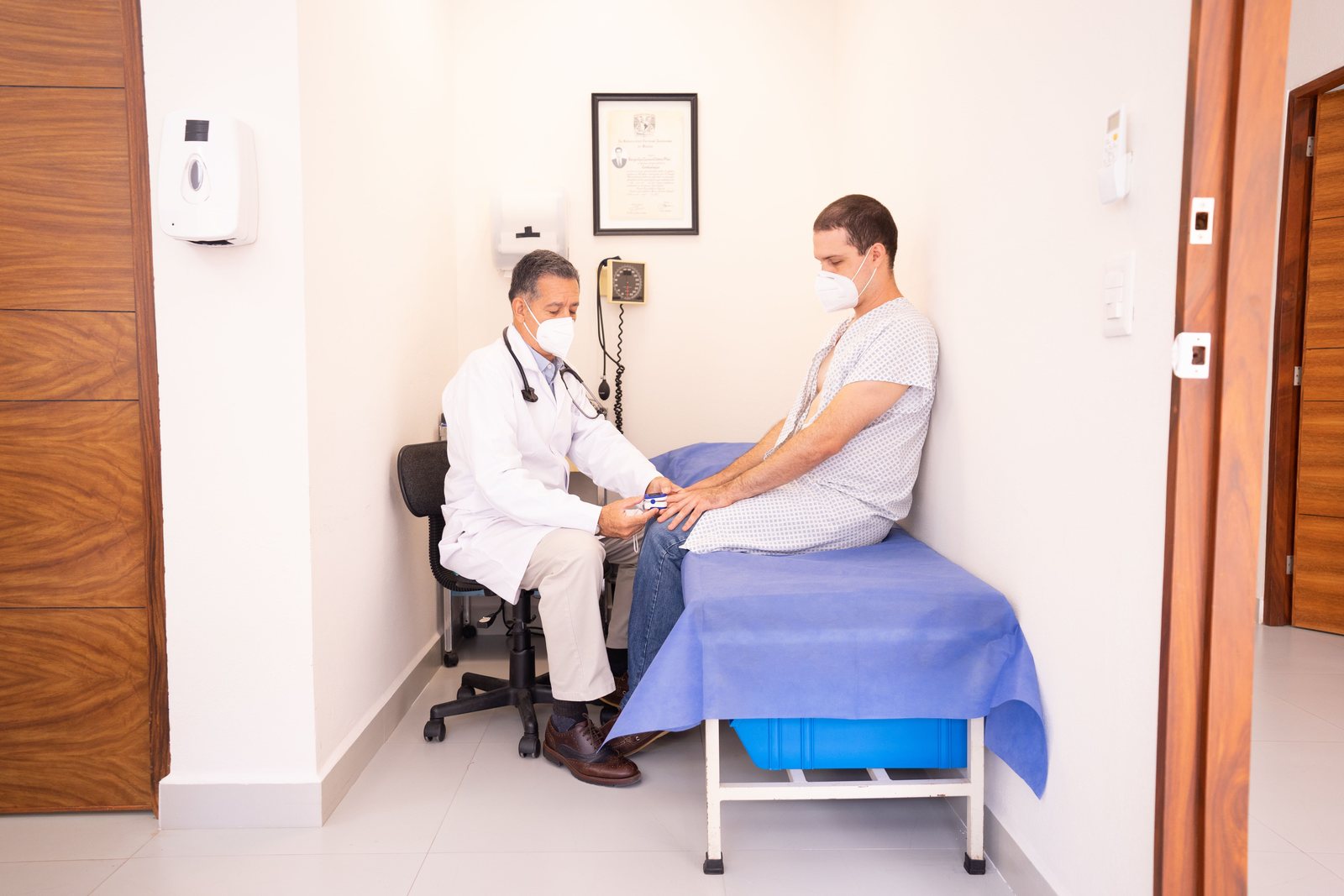 A clinician examining a patient lower leg