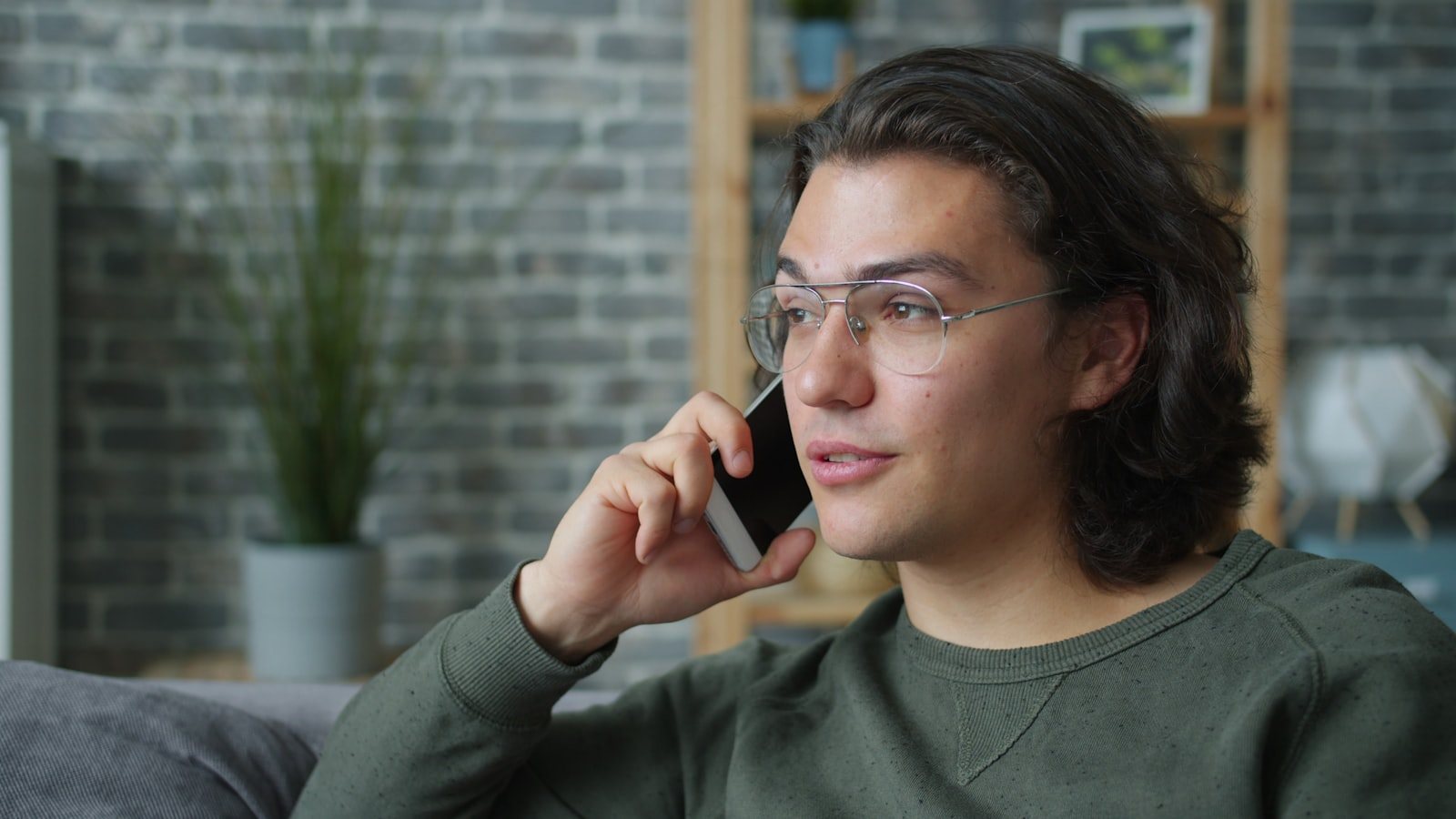 A person making a telephone call at home