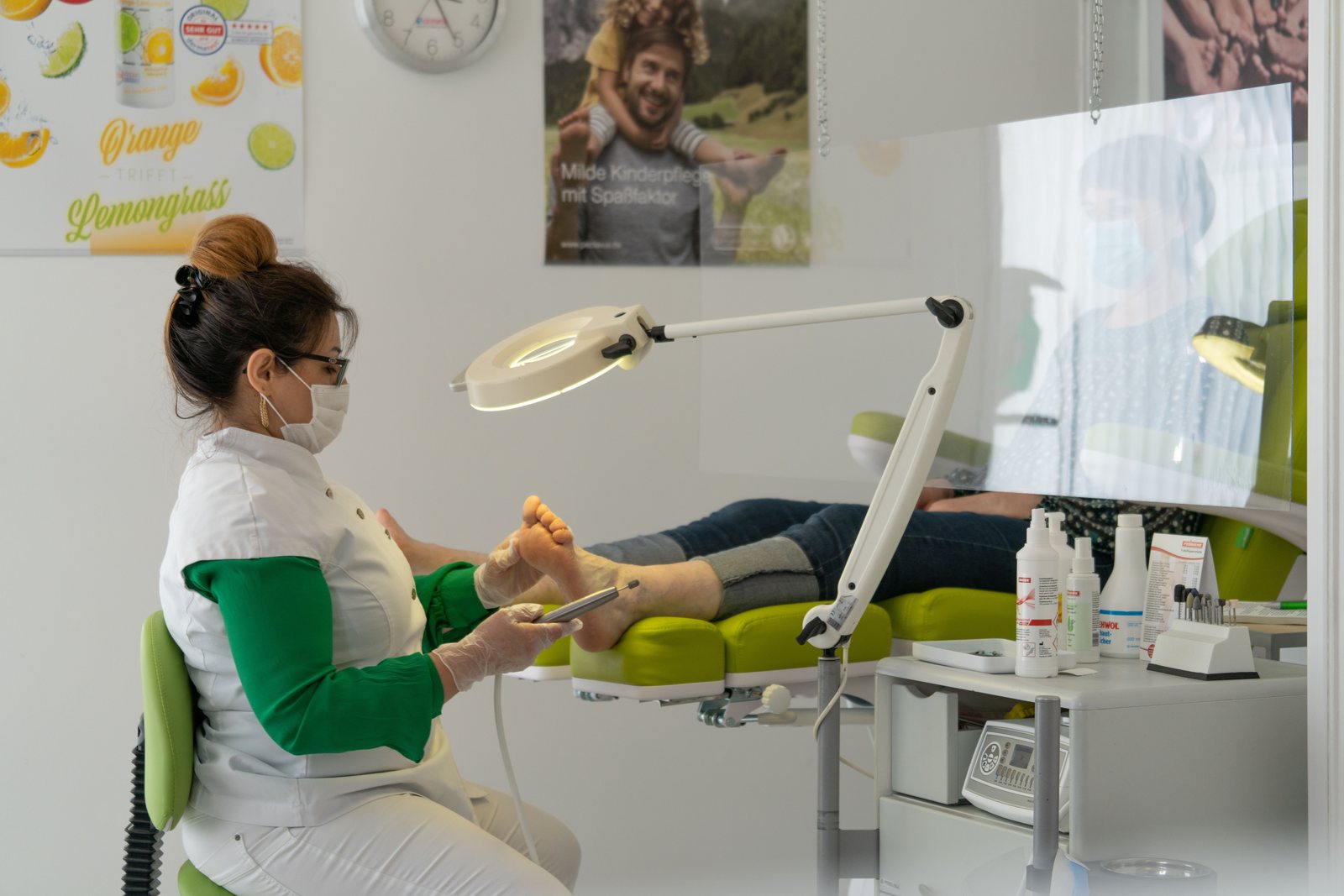 A specialist treating a patient foot