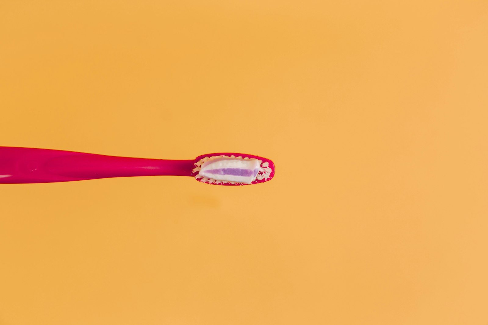 A toothbrush on a plain background