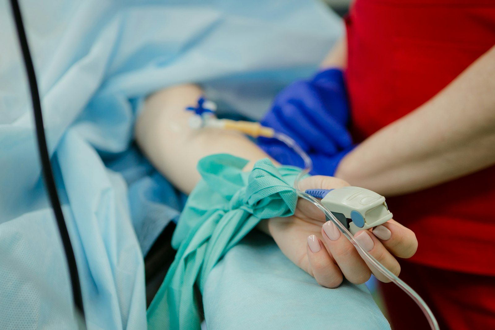 An intravenous drip being adjusted