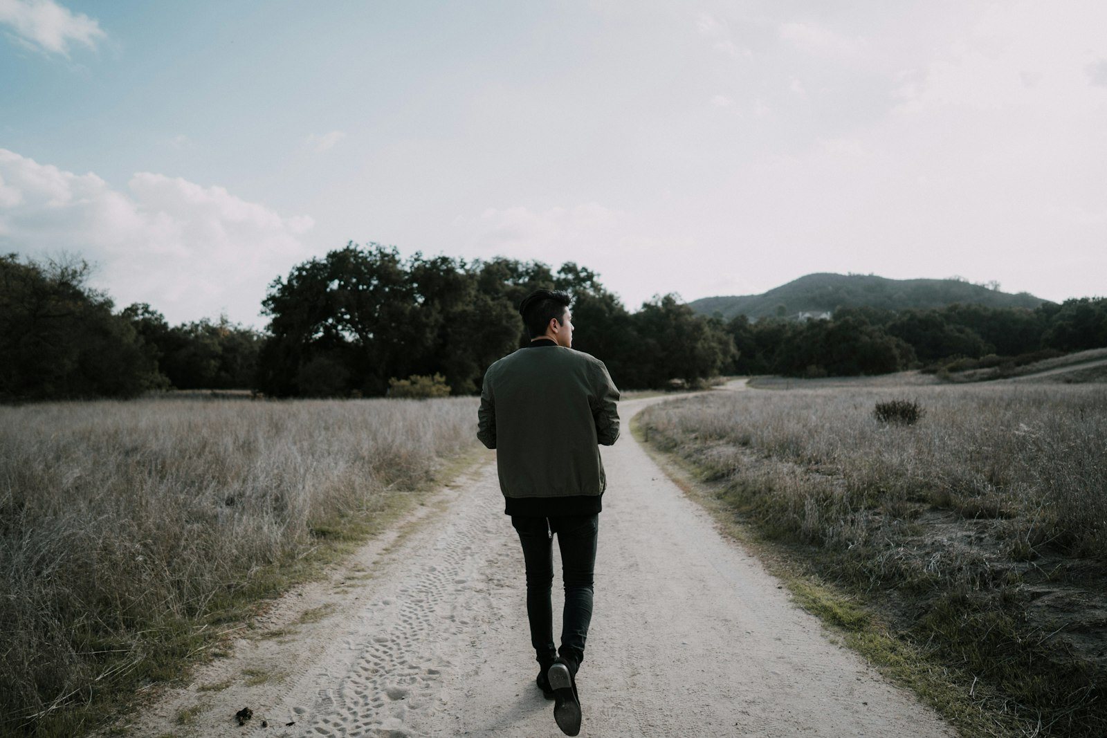 A person walking outdoors in daylight