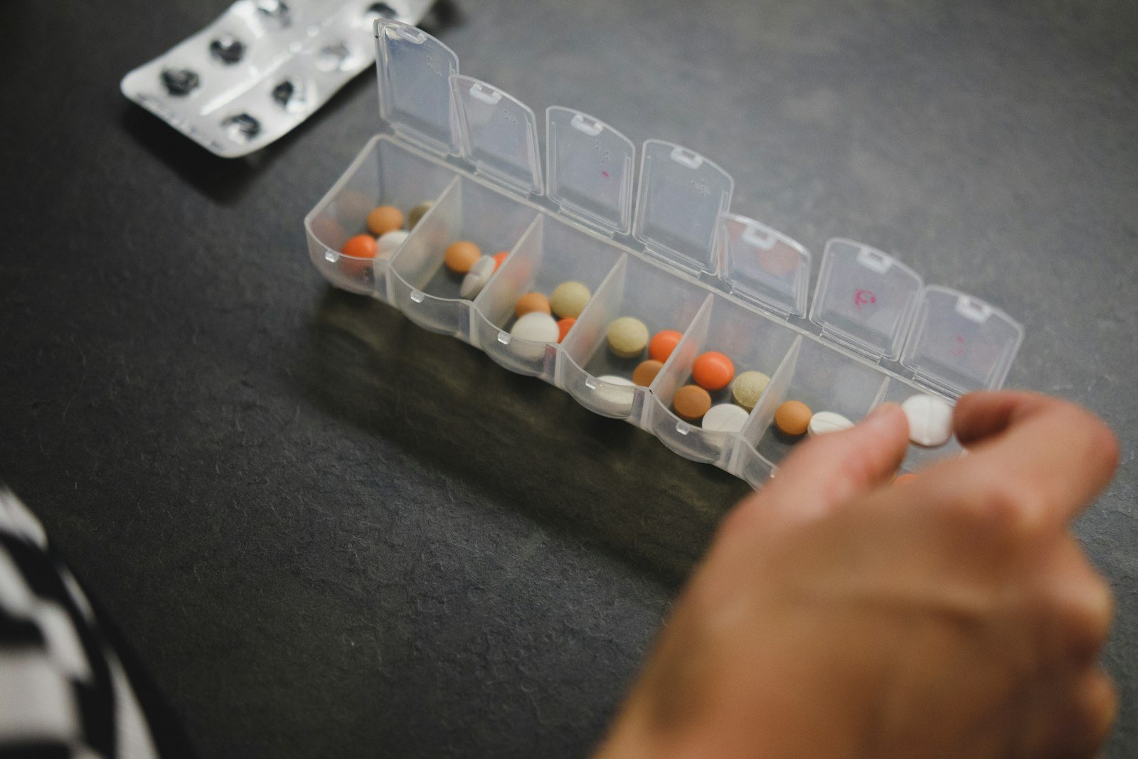 A weekly pill organizer on a table