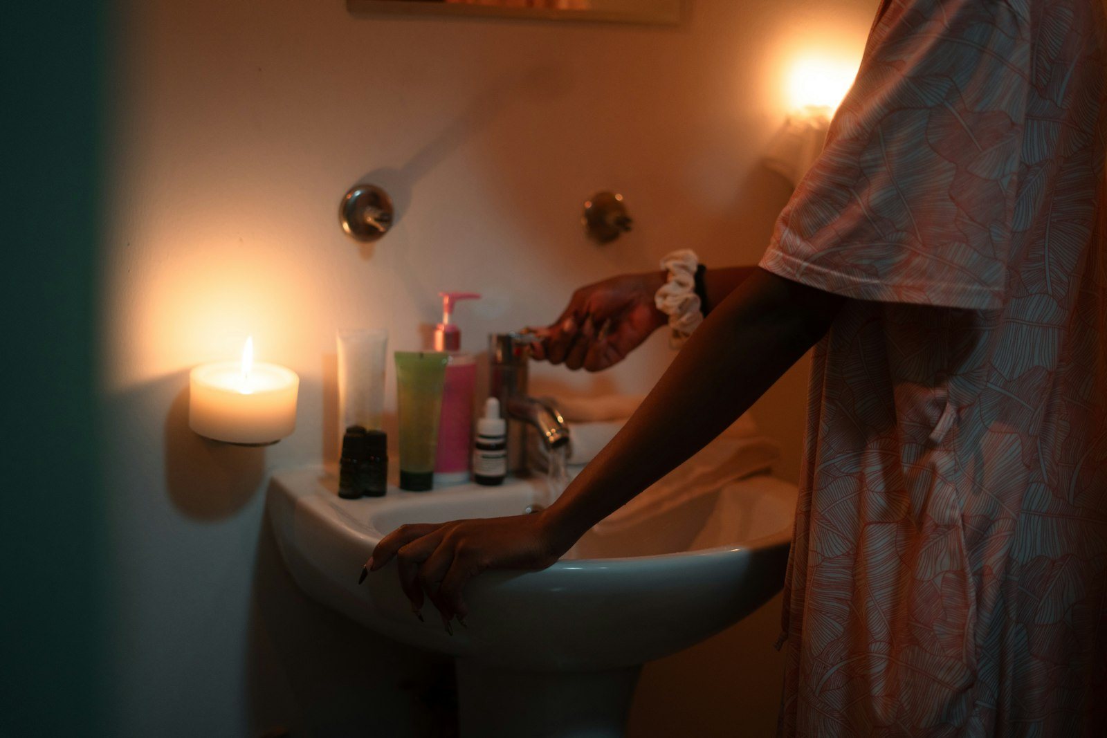 Hands being washed with soap at a sink