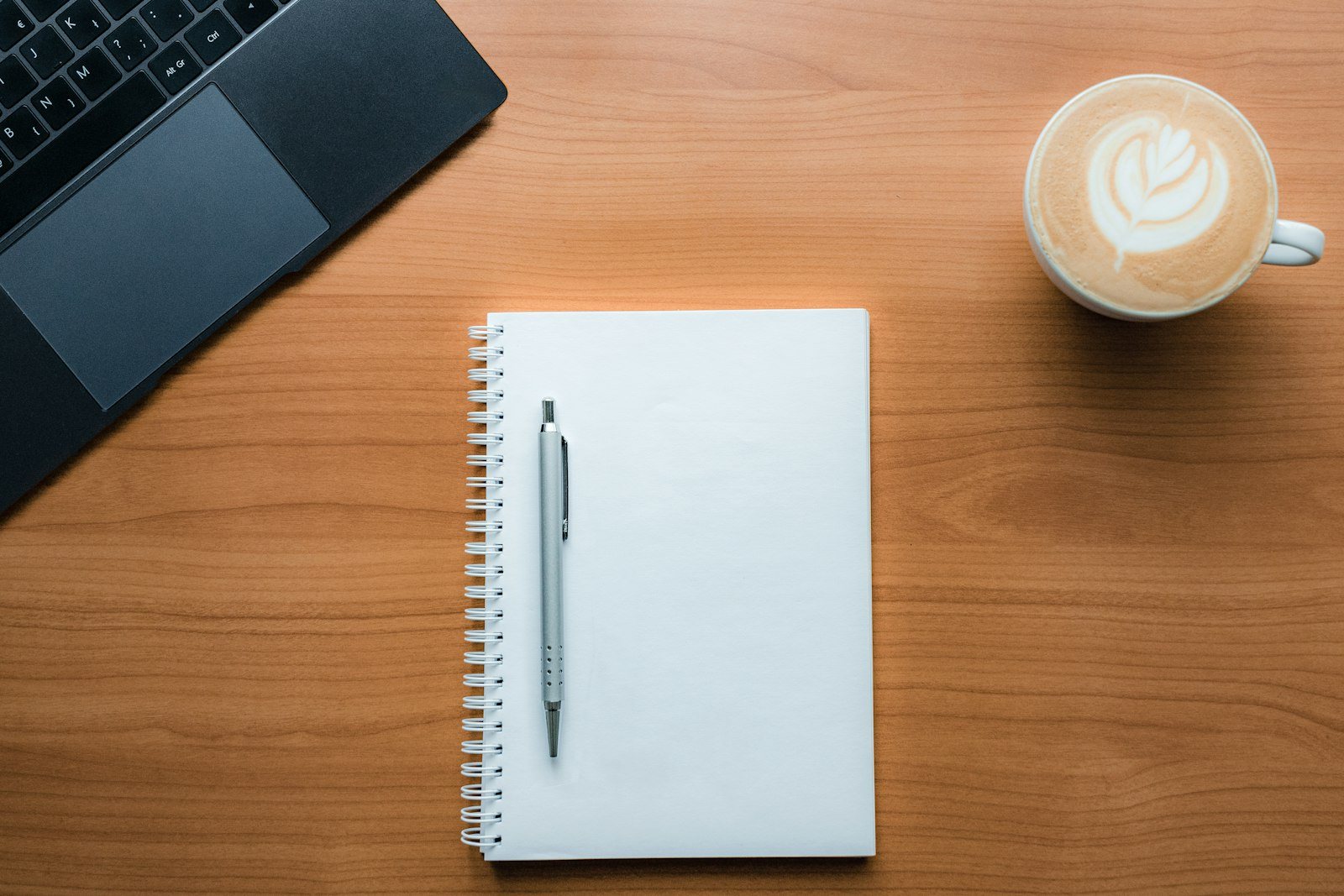 A notebook and pen on a table