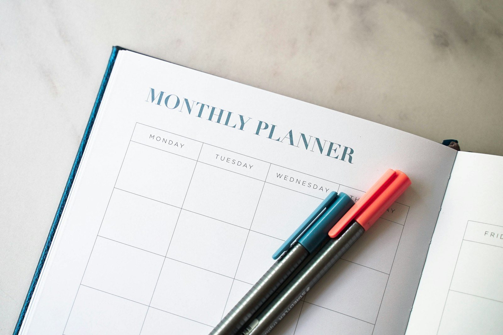 A weekly planner open on a desk