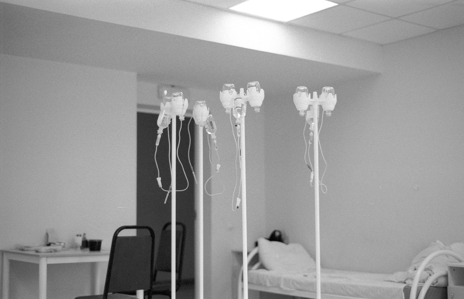 A modern hospital room with an intravenous stand