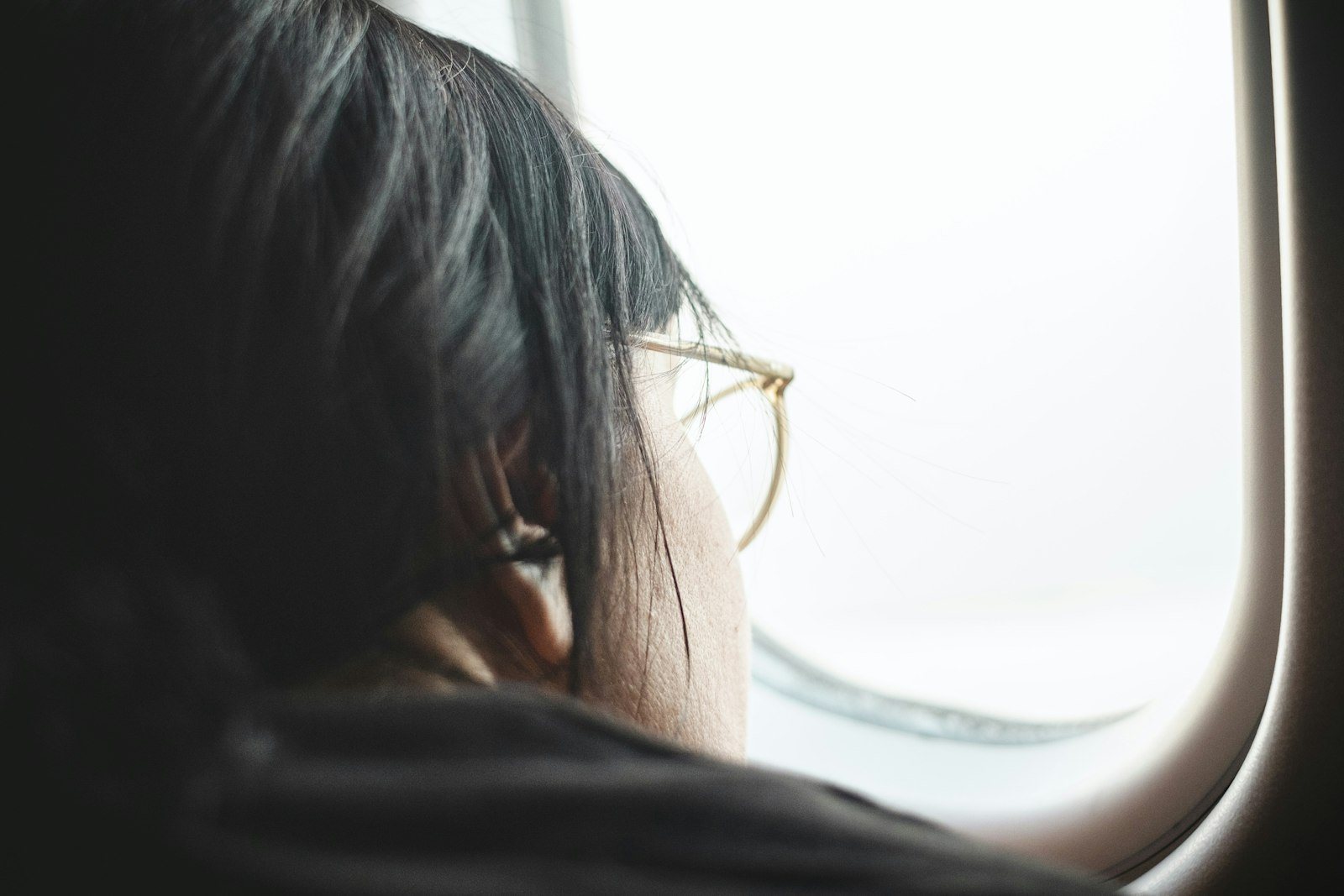 A person resting by a window