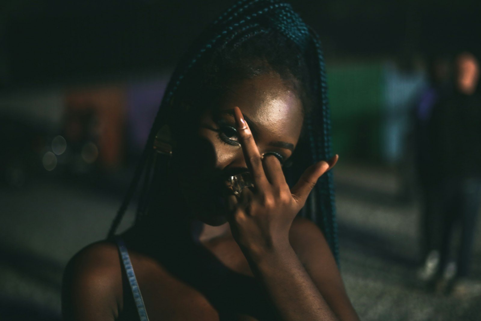 A person pressing their fingers to their forehead