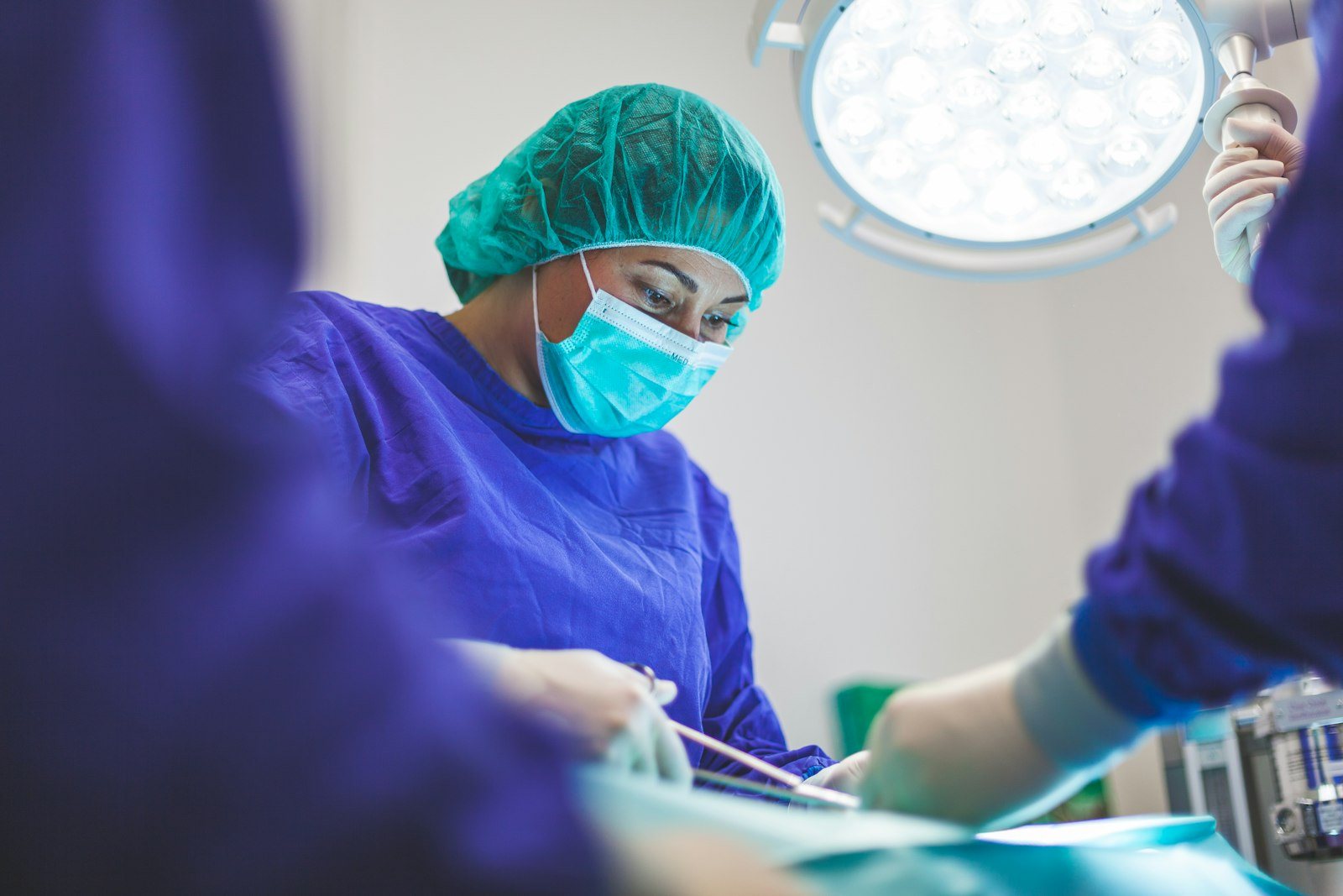 A clinician checking a surgical dressing