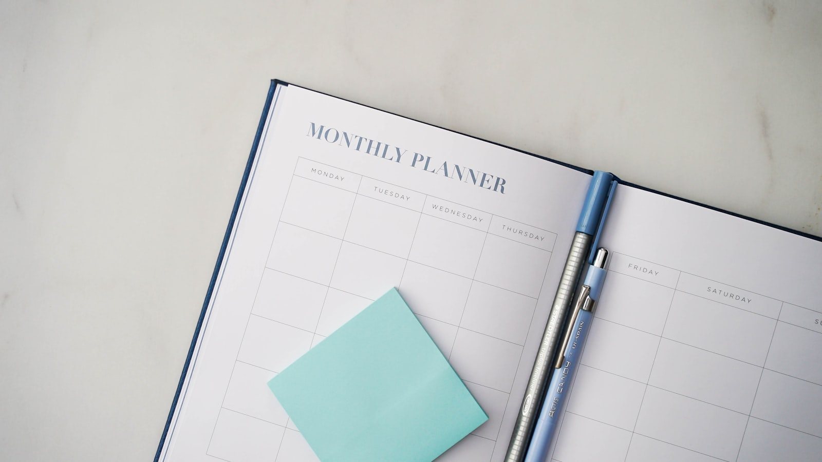 A desk calendar and pen