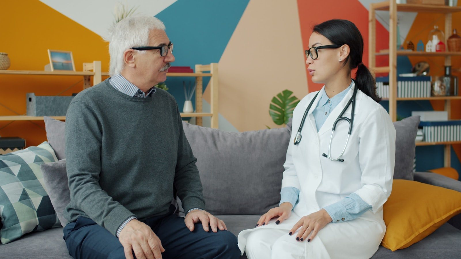 An older adult talking with a clinician