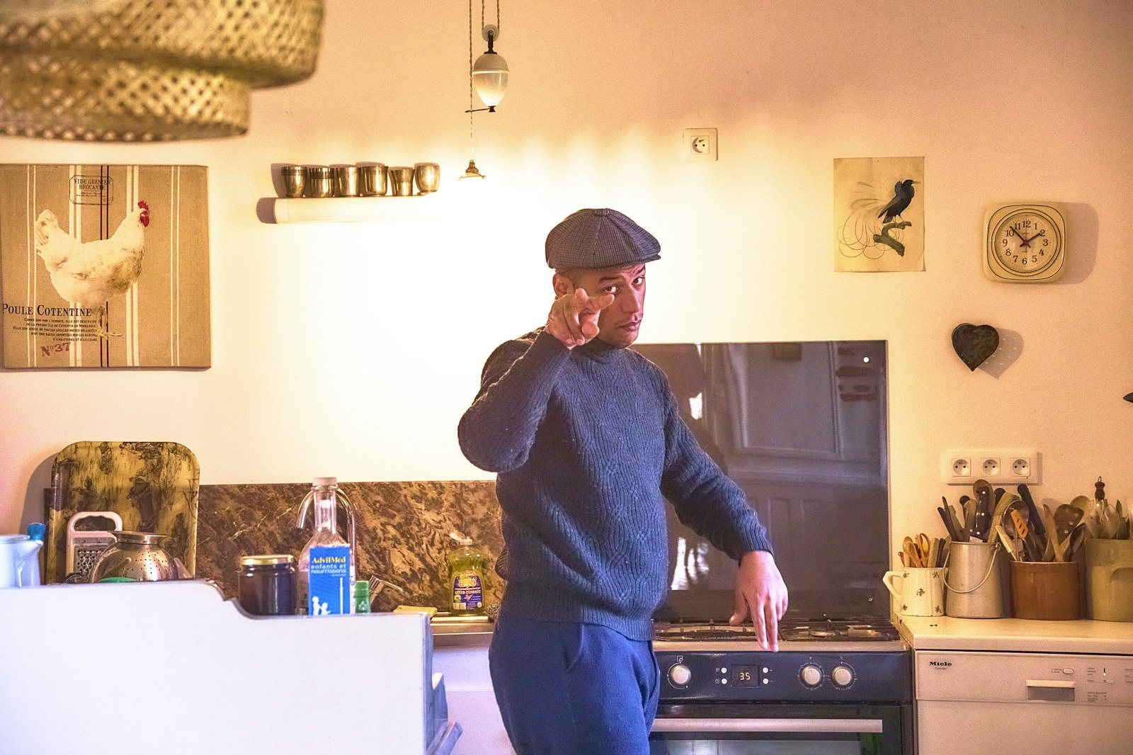 A person standing in a home kitchen
