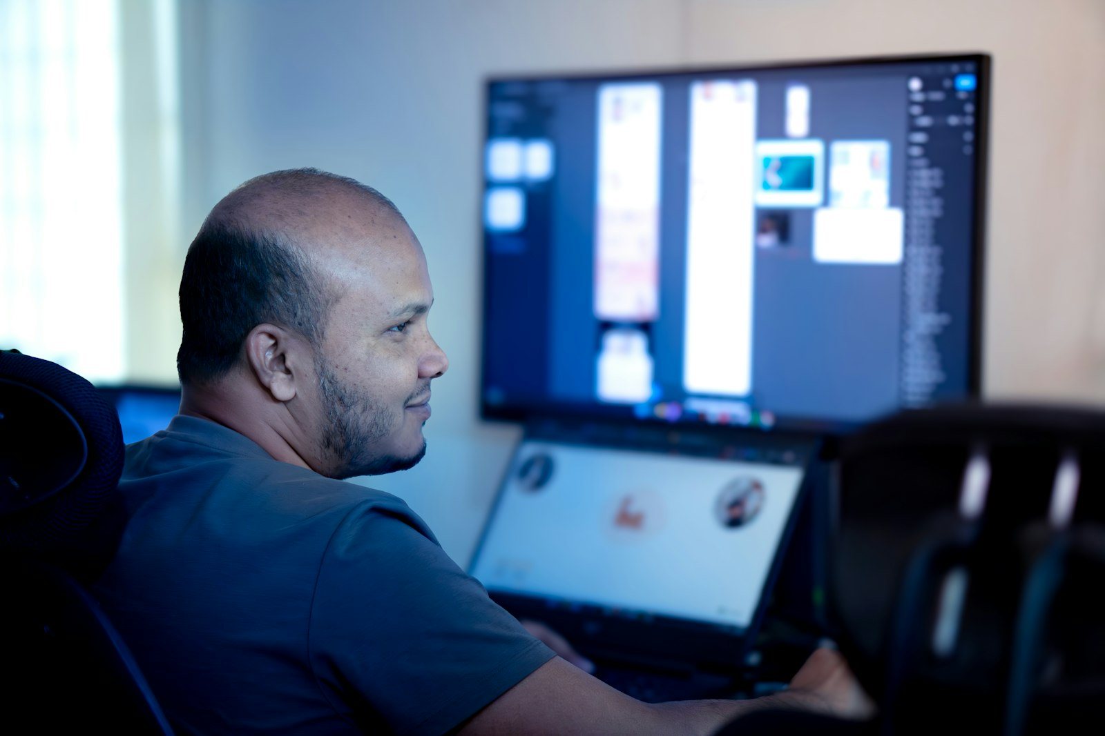 A person reviewing results on a computer monitor