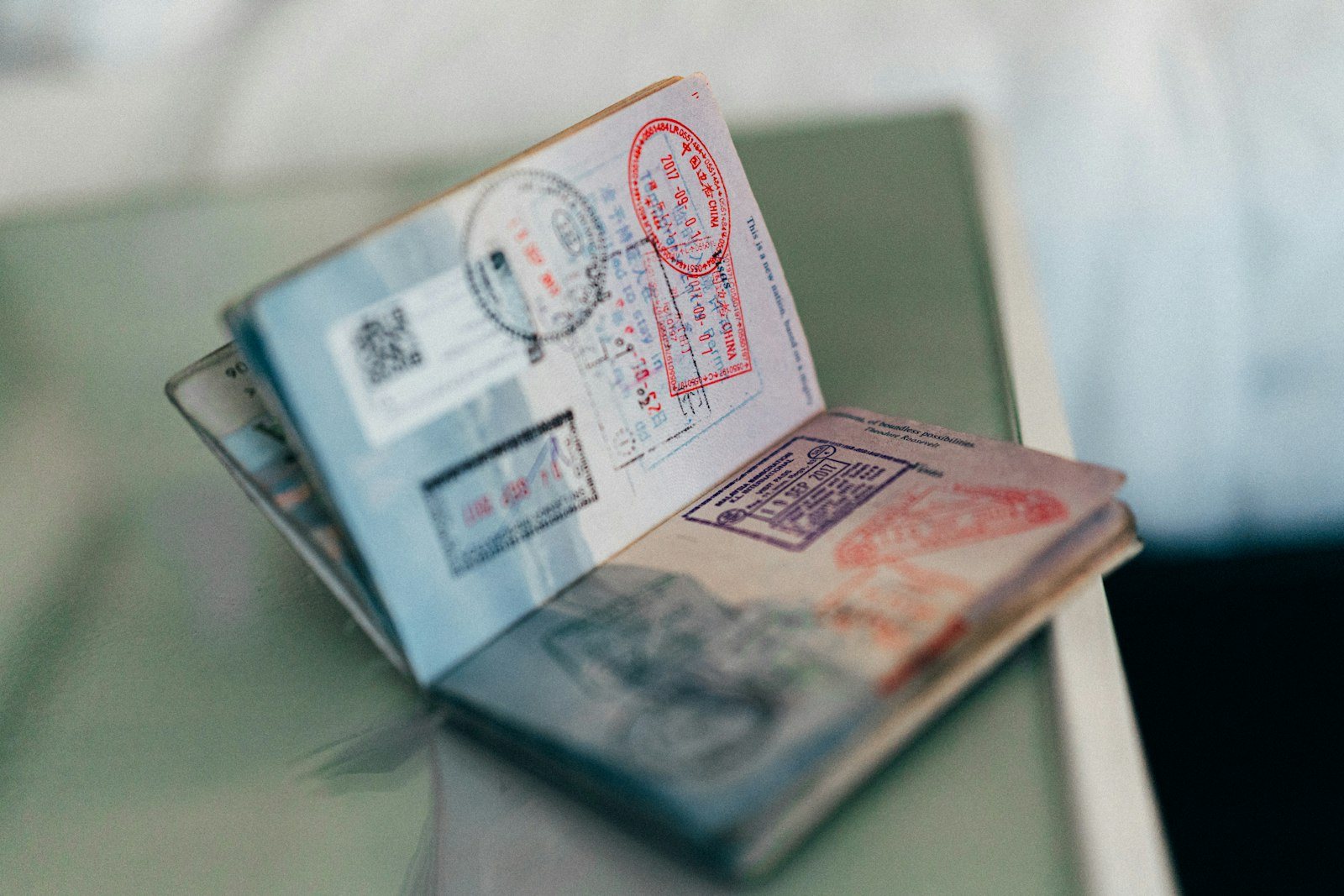 An open passport showing entry stamps