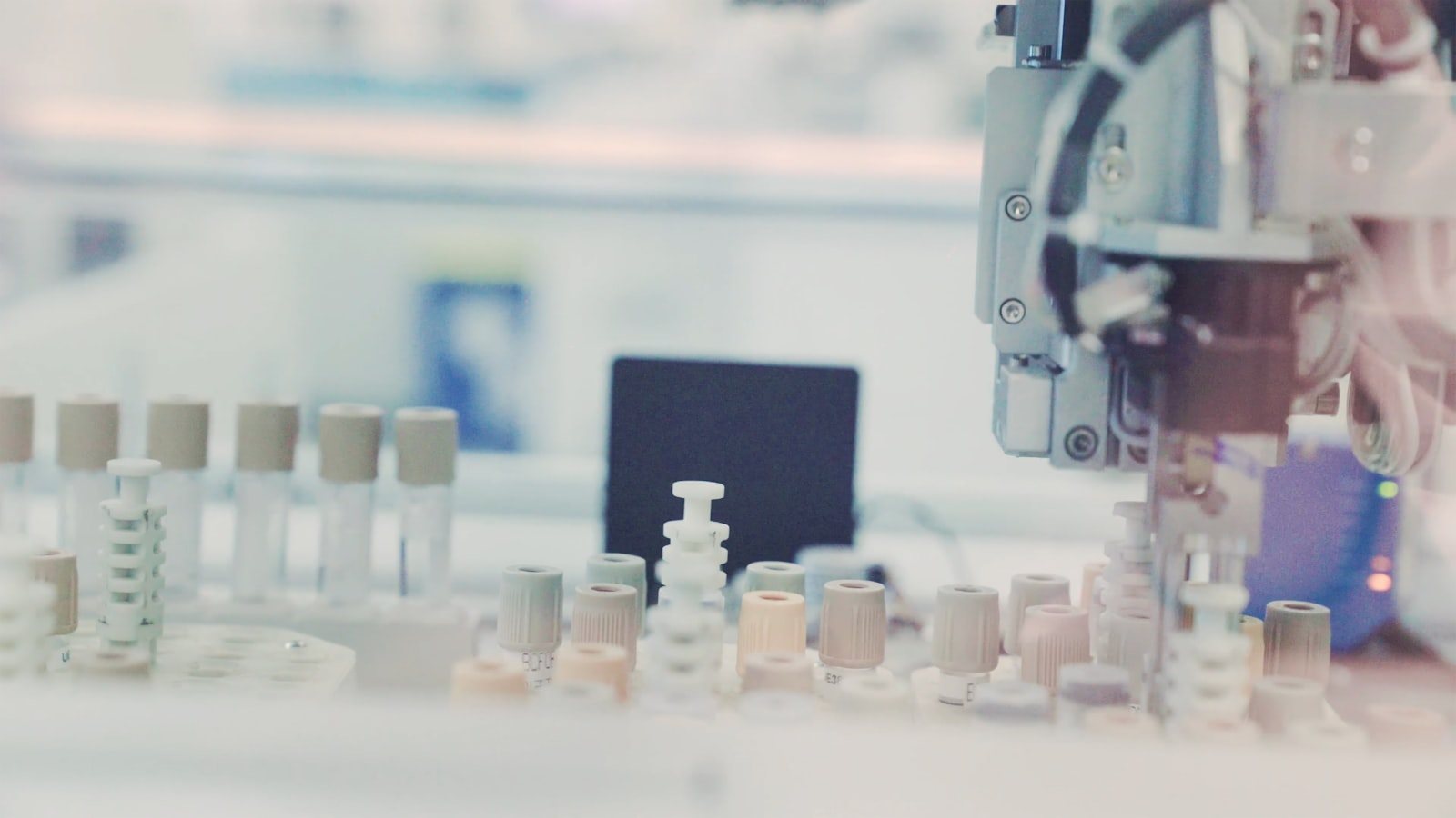 A technician working with sample tubes