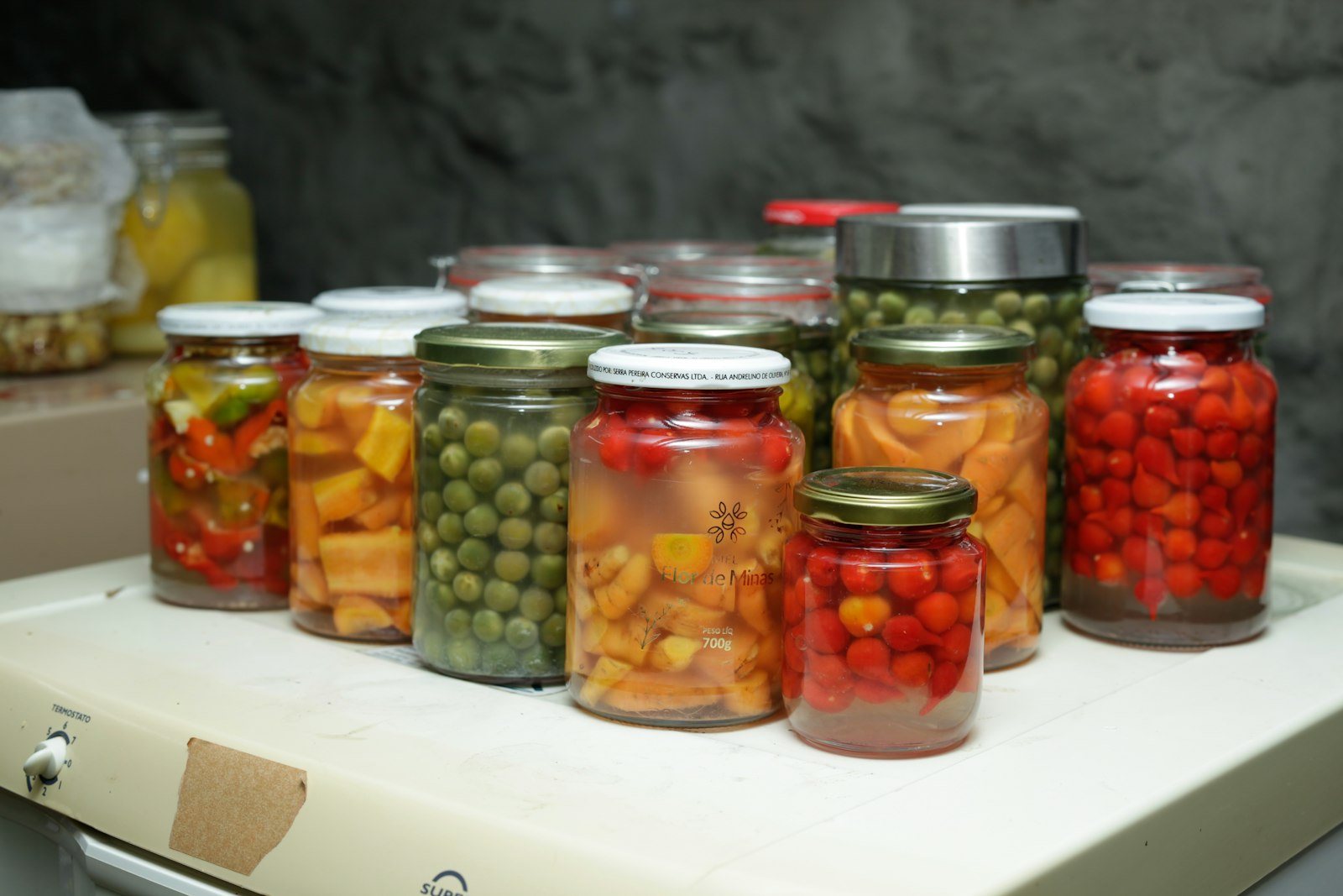 Jars of preserved vegetables on a shelf
