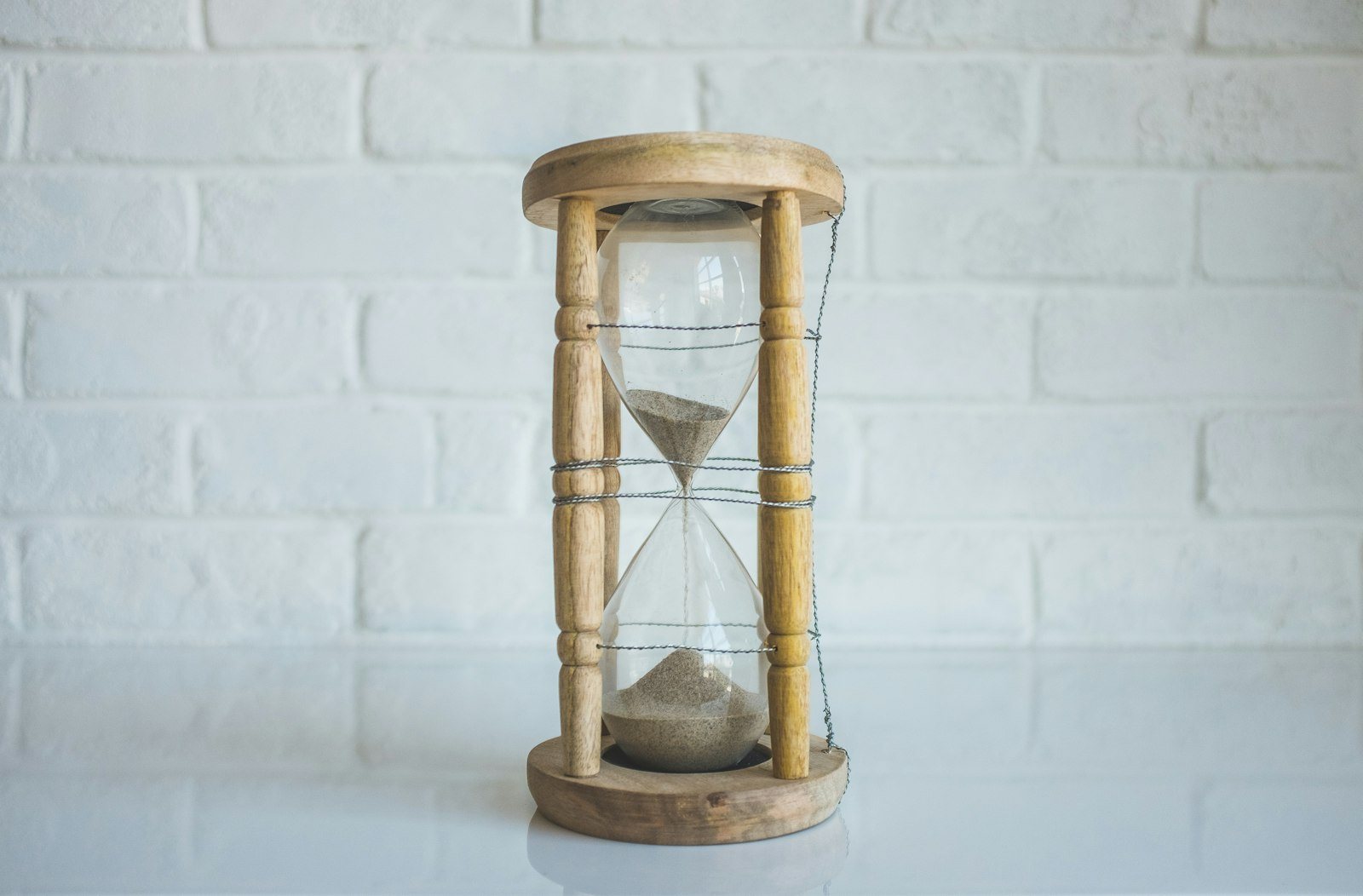 An hourglass standing on a table