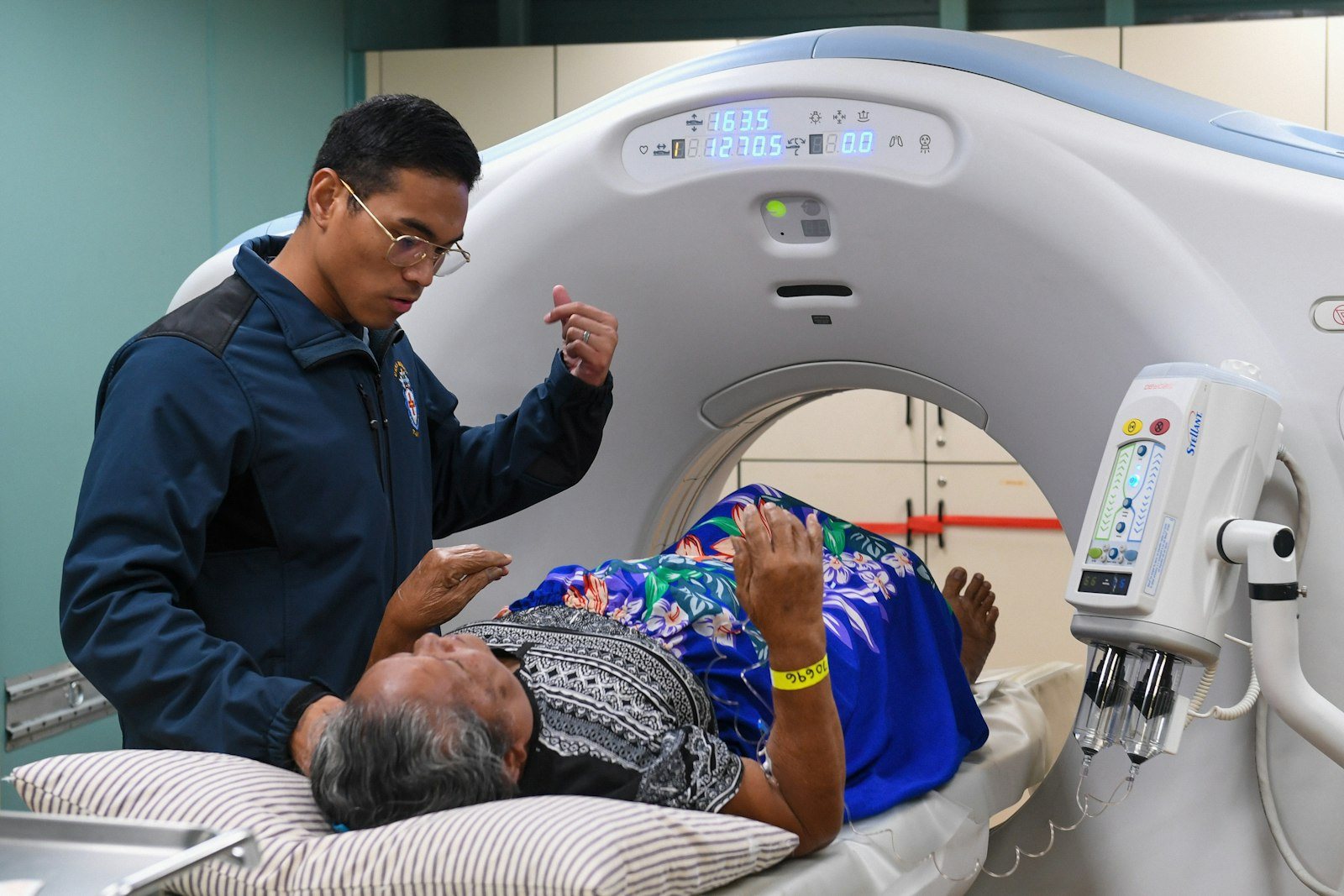 A patient being positioned for a scan
